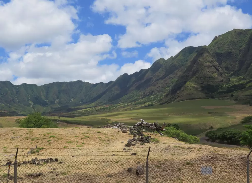 Across the road from the south entrance- gorgeous mountains, and another stripped car.