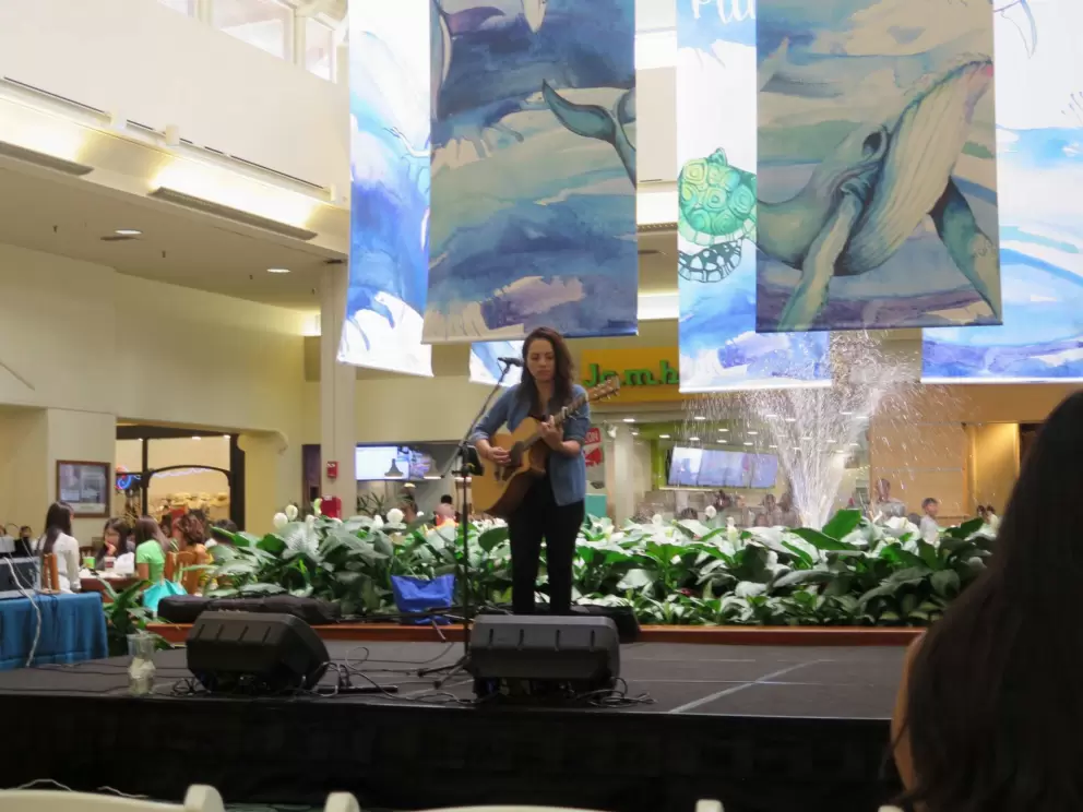 A singer on the stage, at noon on weekends.