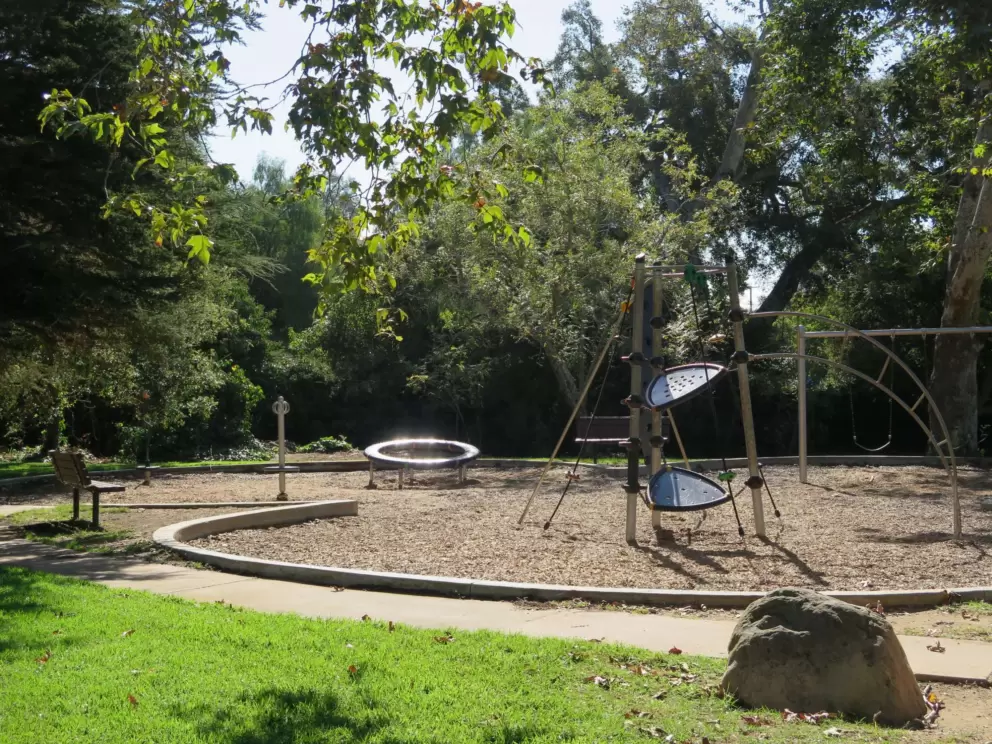 The playground and a boulder.