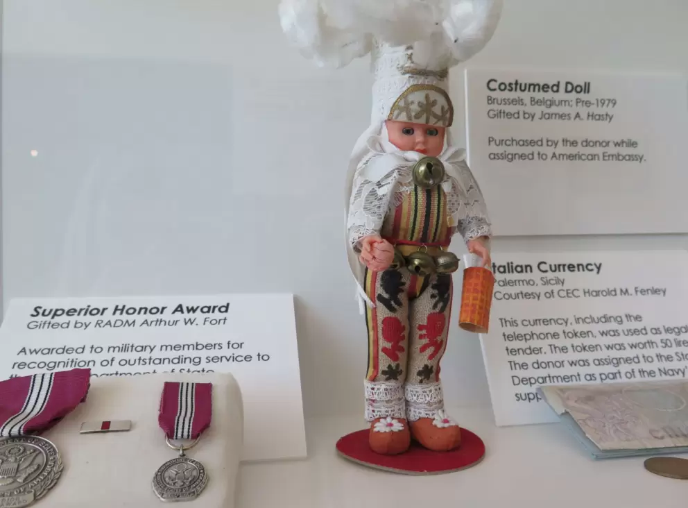 Italian currency and costumed doll from Belgium.