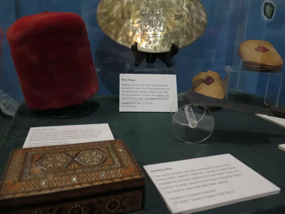 Berber jewelry box purchased in North Africa, and fez worn by the French Morocco Colonial Forces with tassel color depending on wearer's rank. 