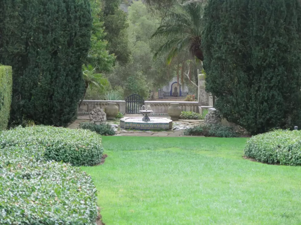 Fountain and cactus garden beyond.