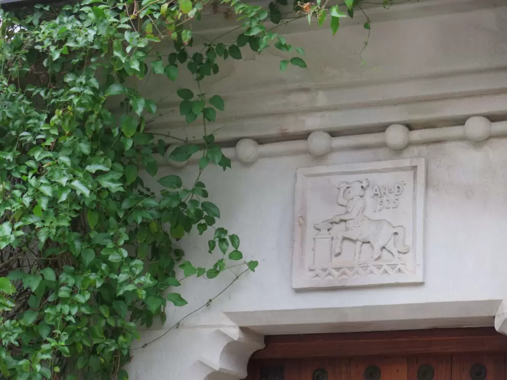 Above the entrance to the house.
