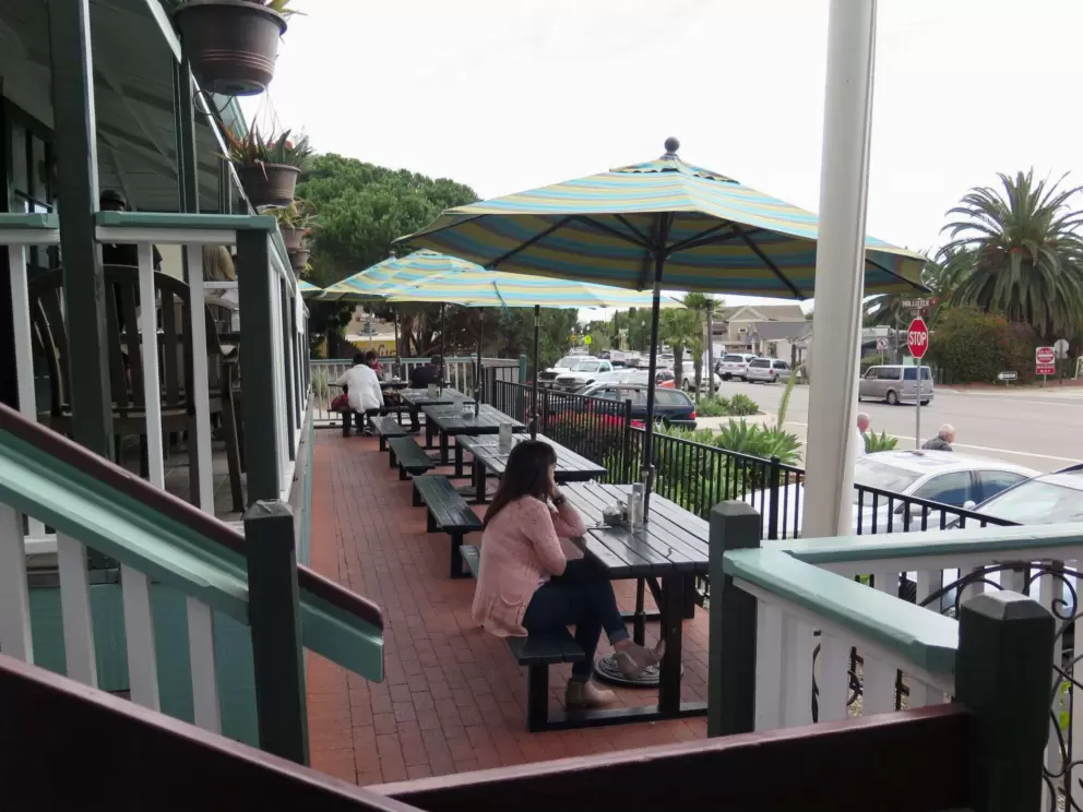Picnic tables on the front balcony, at Summerland Beach Cafe.