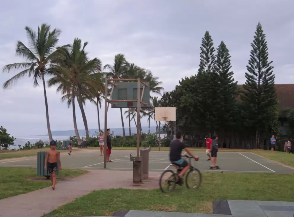 Skateboarding, bike riding, playing basketball.. the happening scene at sunset at Aweoweo Beach Park.