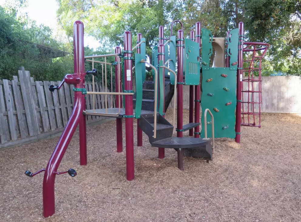 Fun play structure with area like riding a bike. 