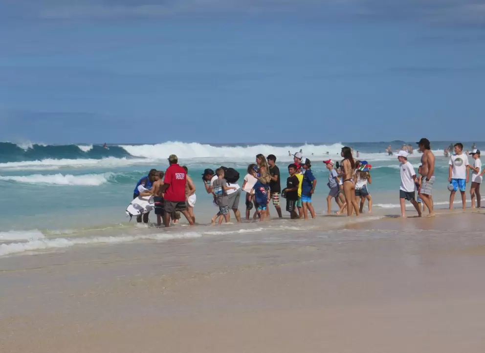 Fans wait for an autograph at the shore.
