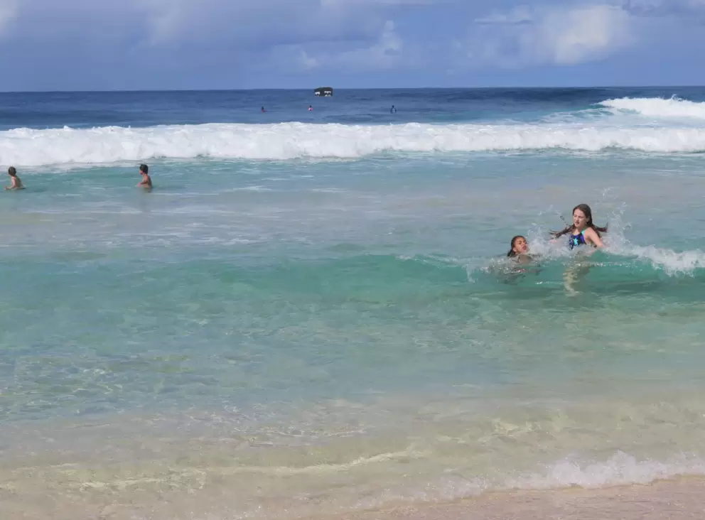 Swimming near the shore.