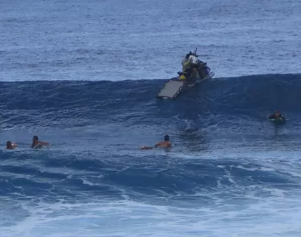 Photographer at the top of a wave.
