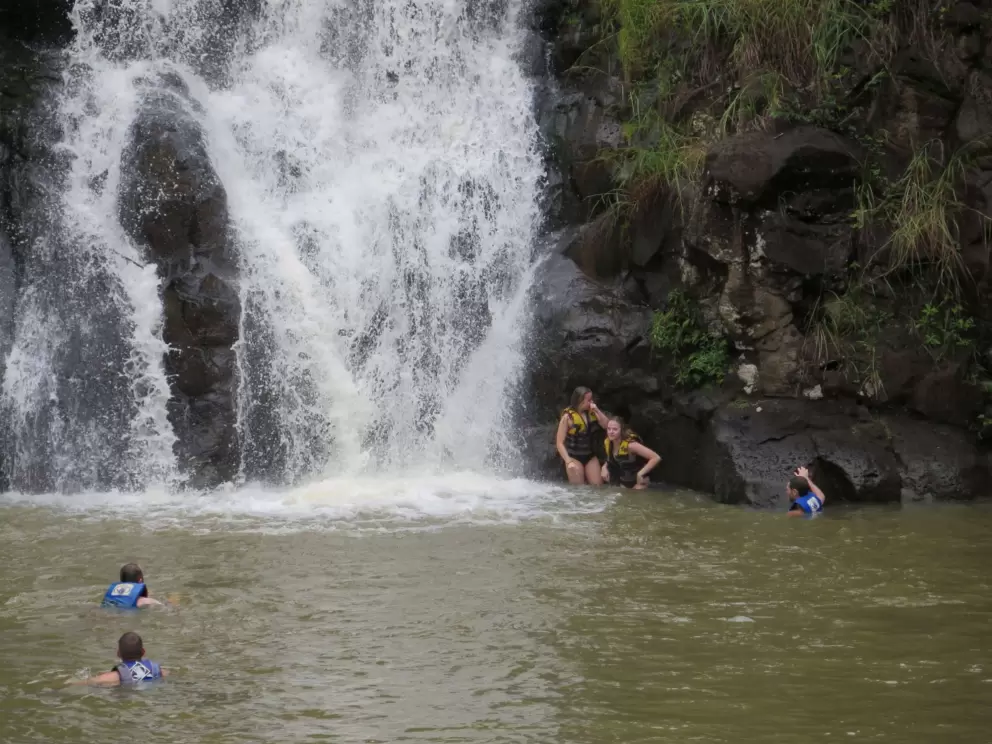 Swimming by the waterfall.