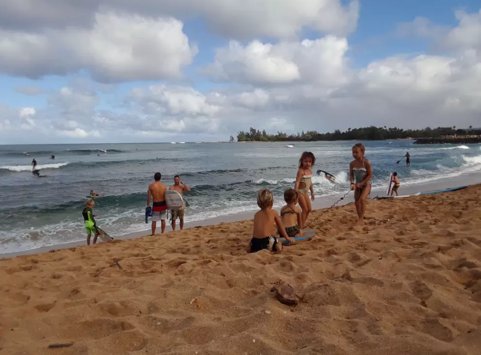 Kids playing in the sand.