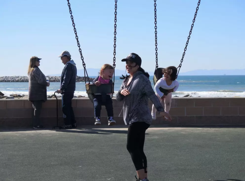 Toddlers loving the baby swings.