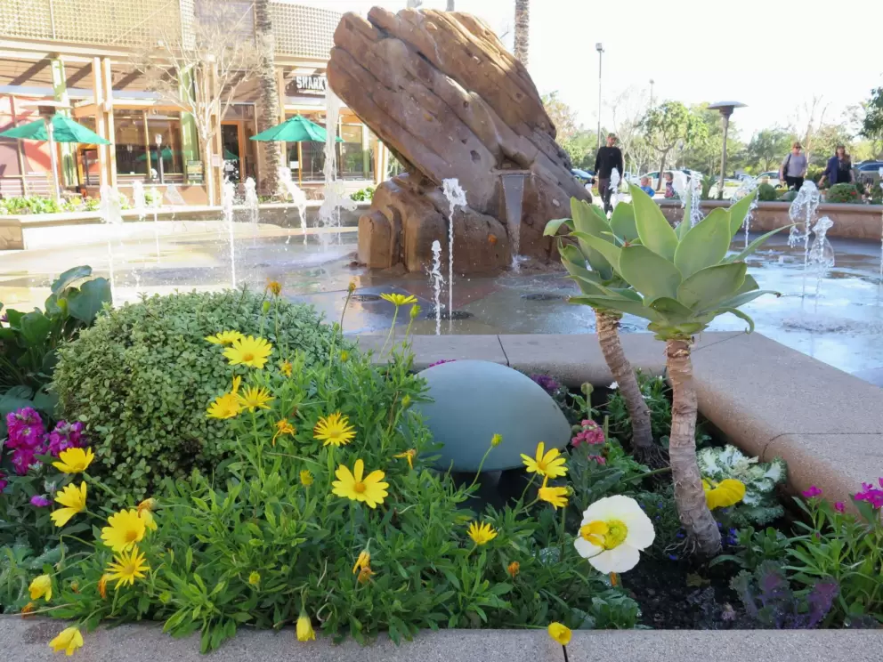 Flowers by the fountain.