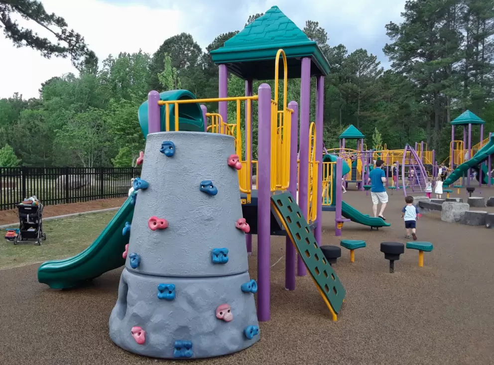 The little kid structure with rock climbing wall.