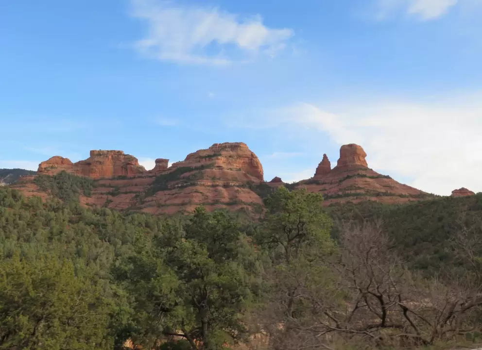 Blue sky and red rock shapes.