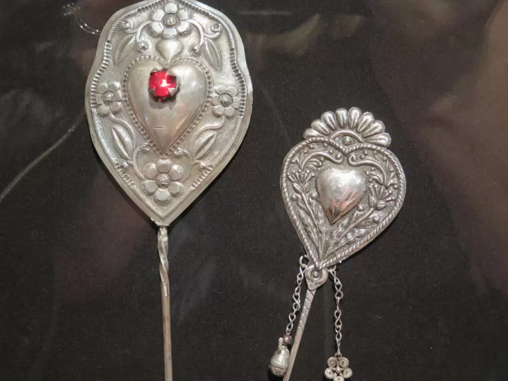 Heart mantle pins from Peru, at the Museum of International Folk Art.