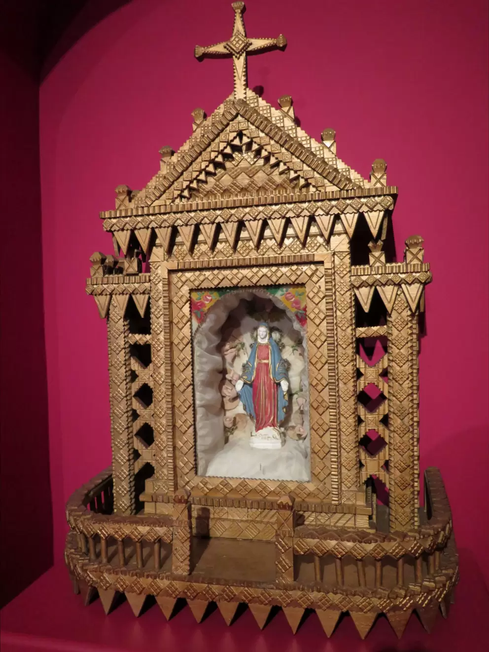 Tramp art home altar. Tramp art was not made by tramps but started with skilled craftsmen from Northern and Eastern Europe, and involved woodworking with notches and layers. 