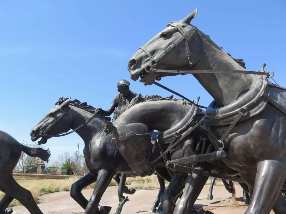 Horses racing forward in the Centennial Land Run Sculpture.