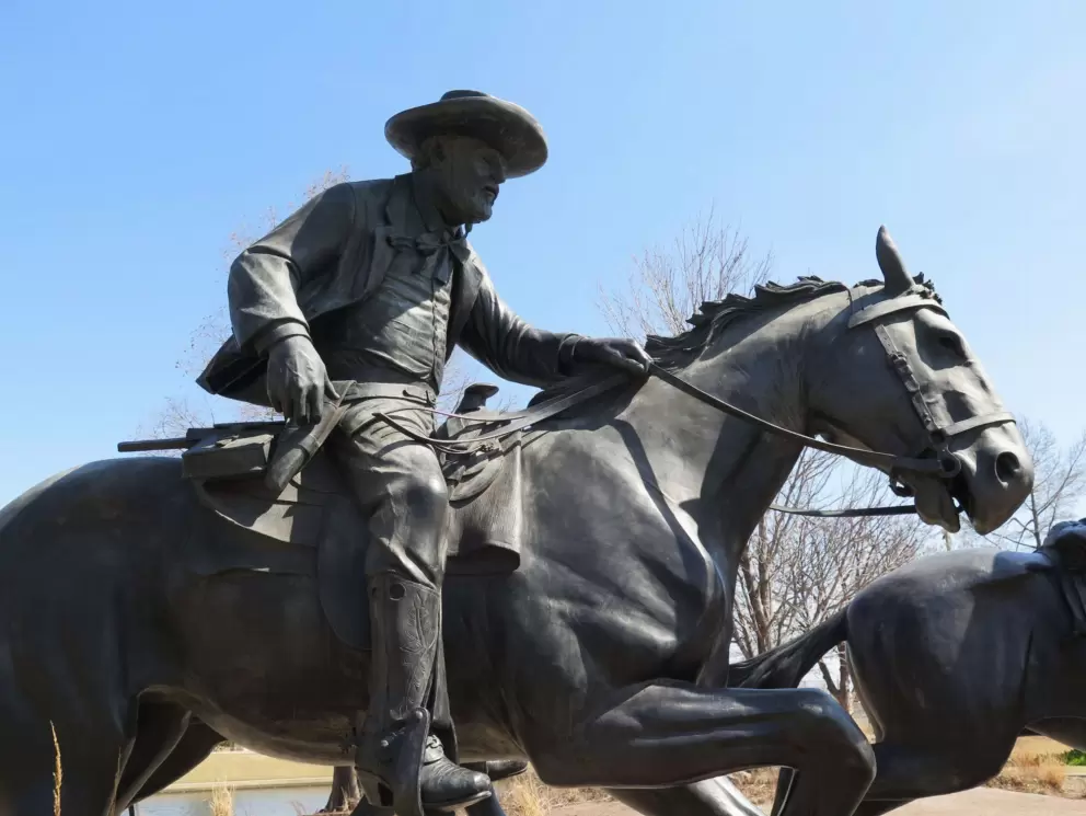 Rider, with a hat and boots, in the Centennial Land Run Sculpture.