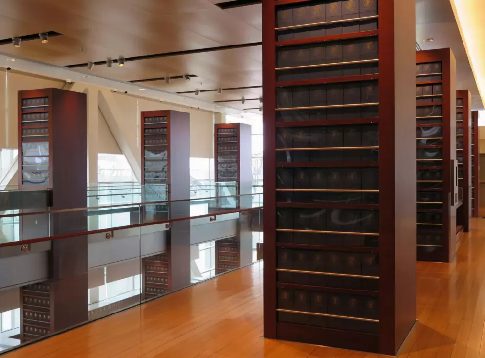 Blue boxes containing presidential records. The room is modeled after the Long Room at Trinity College Dublin.