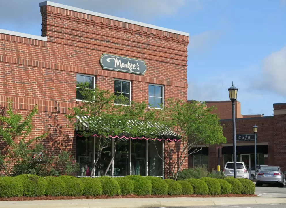 Cute brick building and spherical hedges.