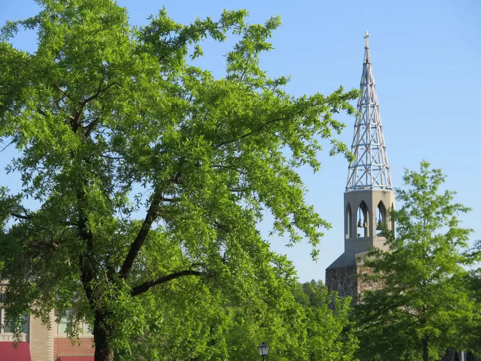 The church steeple with chiming bells.
