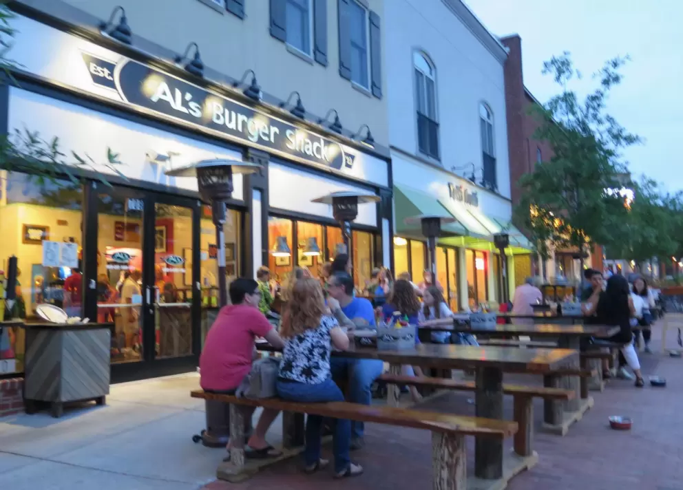 Outside Al's Burger Shack at night.