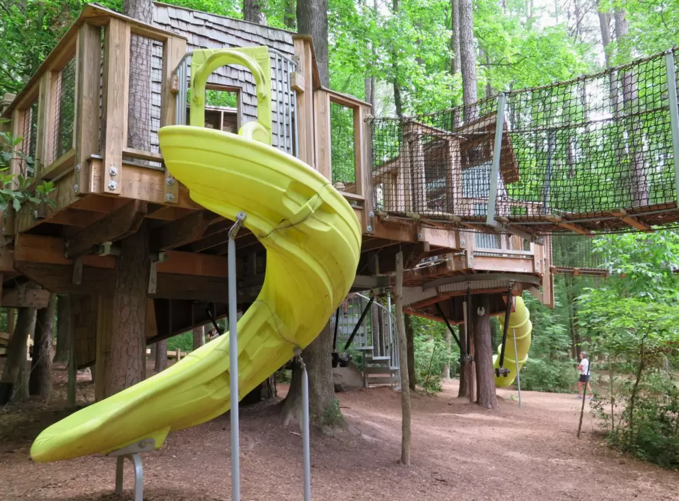 Yellow slide and rope bridge.