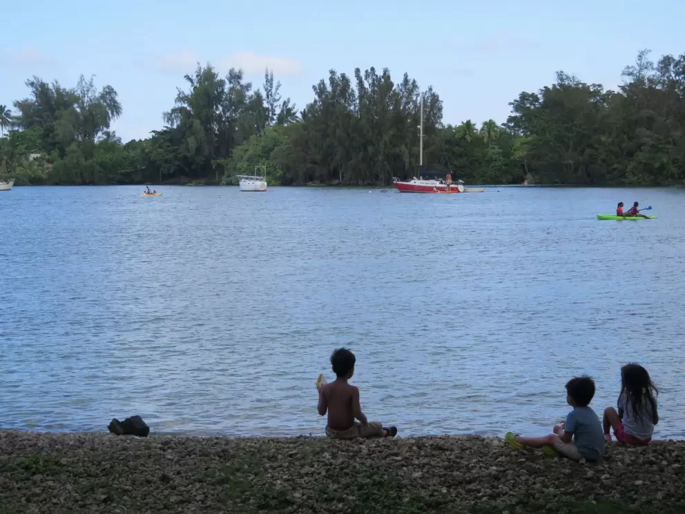 Kids cruising on the shore, the wind in their hair.