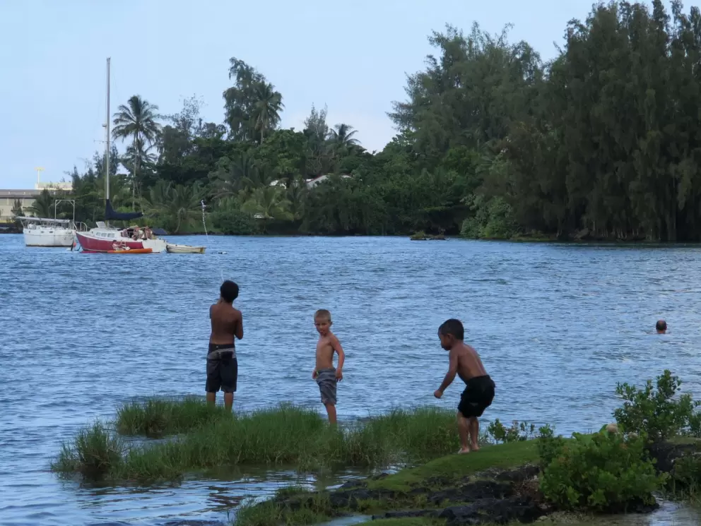 Kids exploring the water's edge.