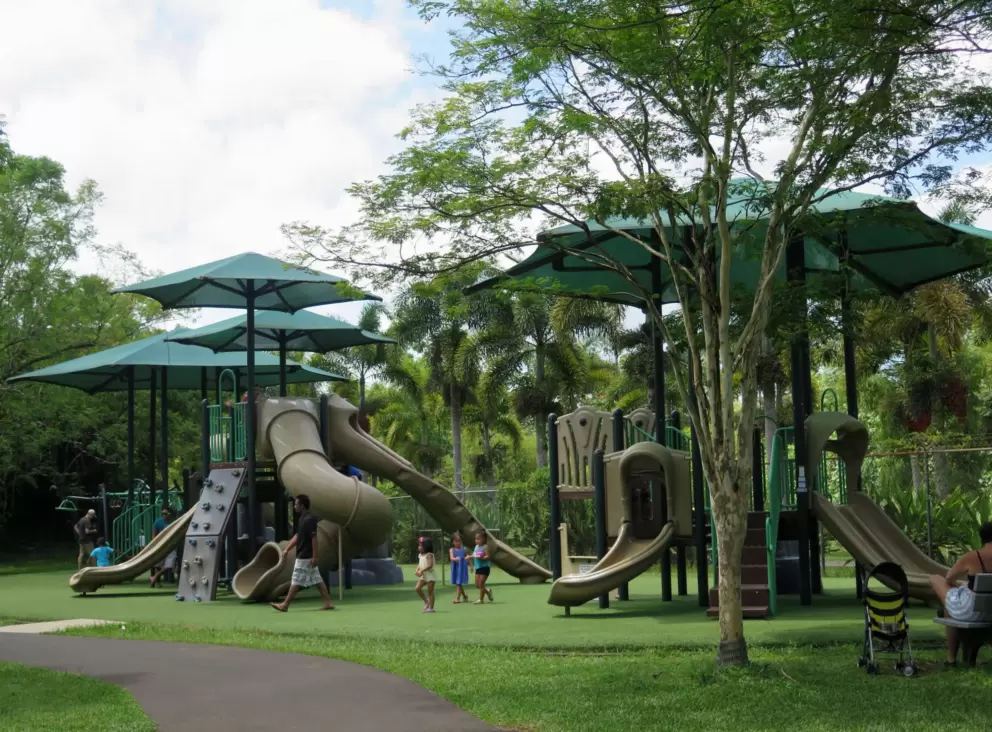 Huge playground with shade umbrellas.