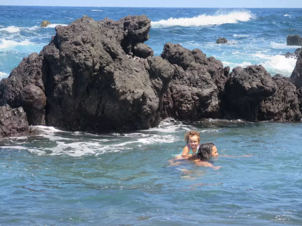 Little girl on her dad's back. 