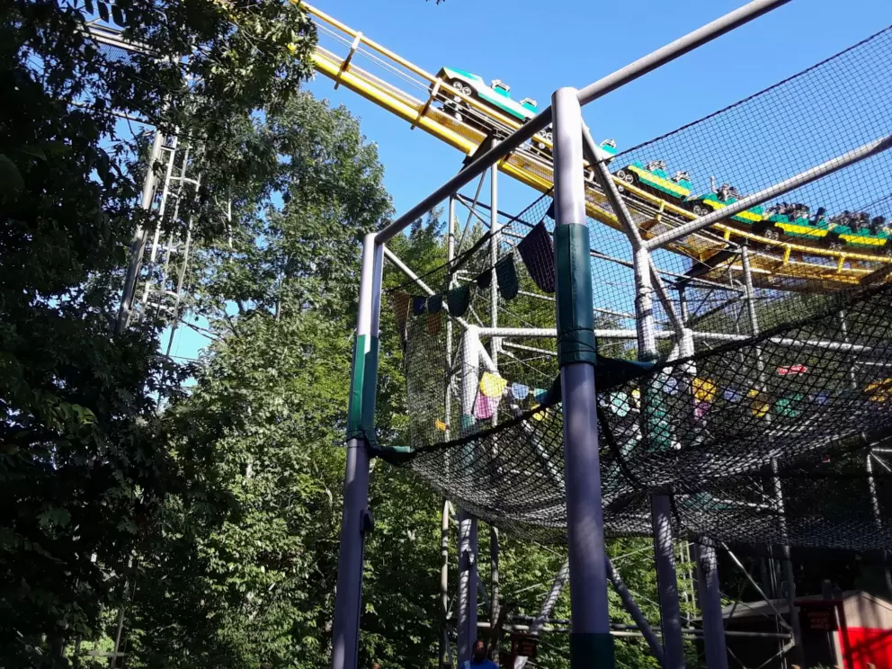 Loch Ness Monster roller coaster whooshes by Land of the Dragons.