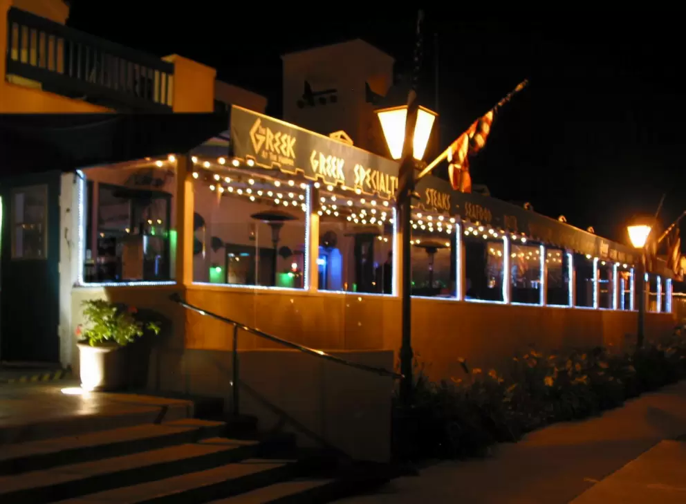 The Greek has a nice semi-outdoor area surrounded by glass to keep you warm.