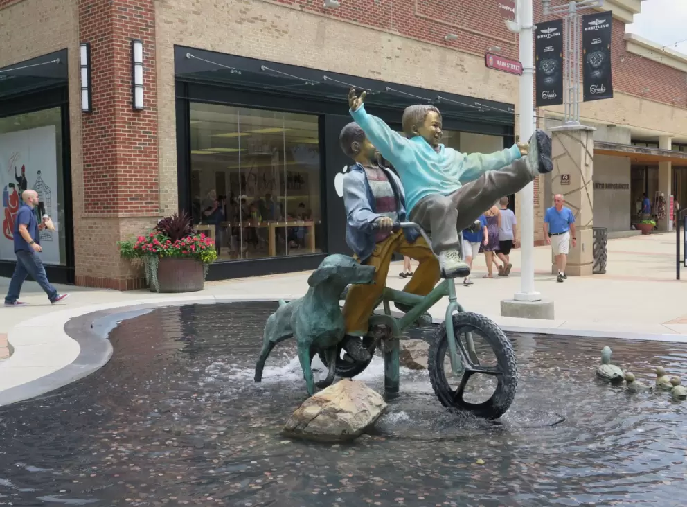 Bike riding sculpture.