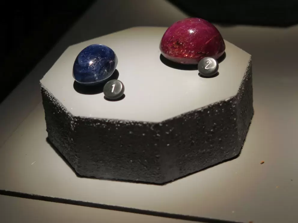 49 carat blue sapphire, 103 carat ruby with six point star.