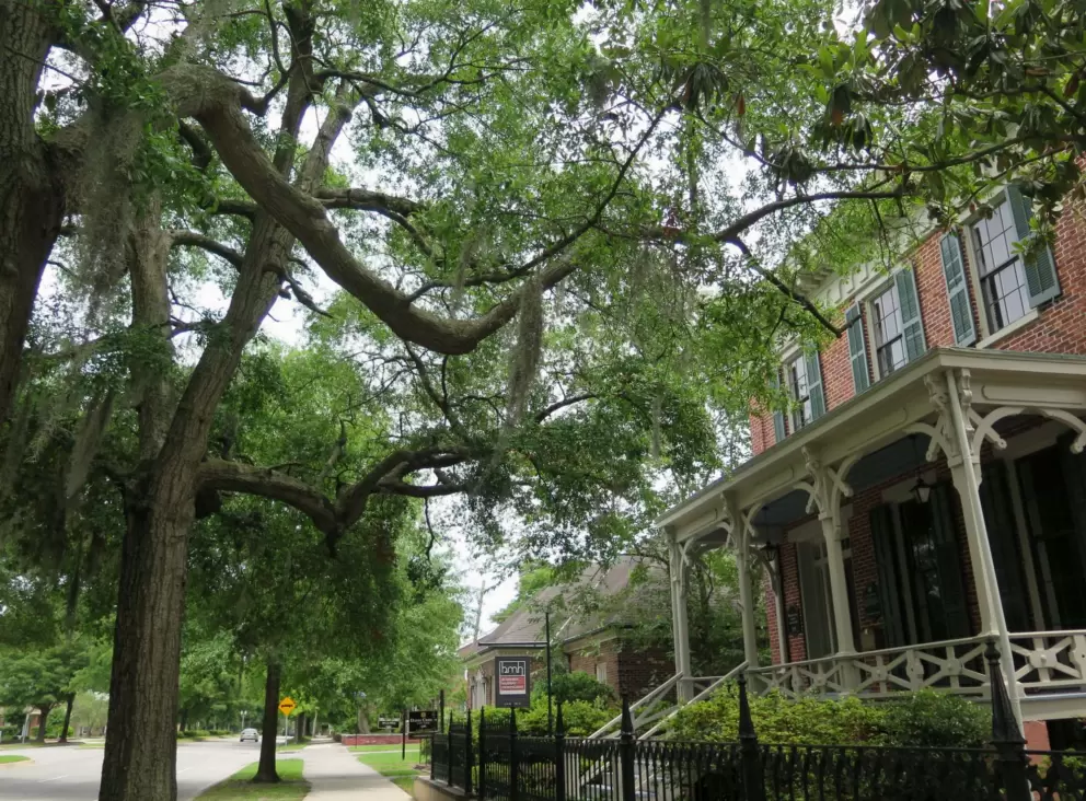 Historic house with ornate patio.