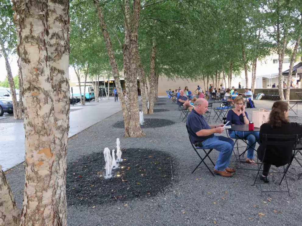 Front courtyard with trees and fountains.