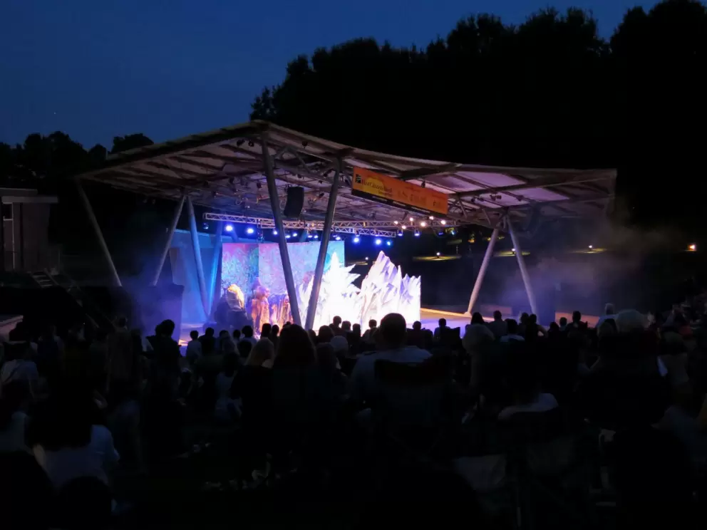 The stage and forest behind.