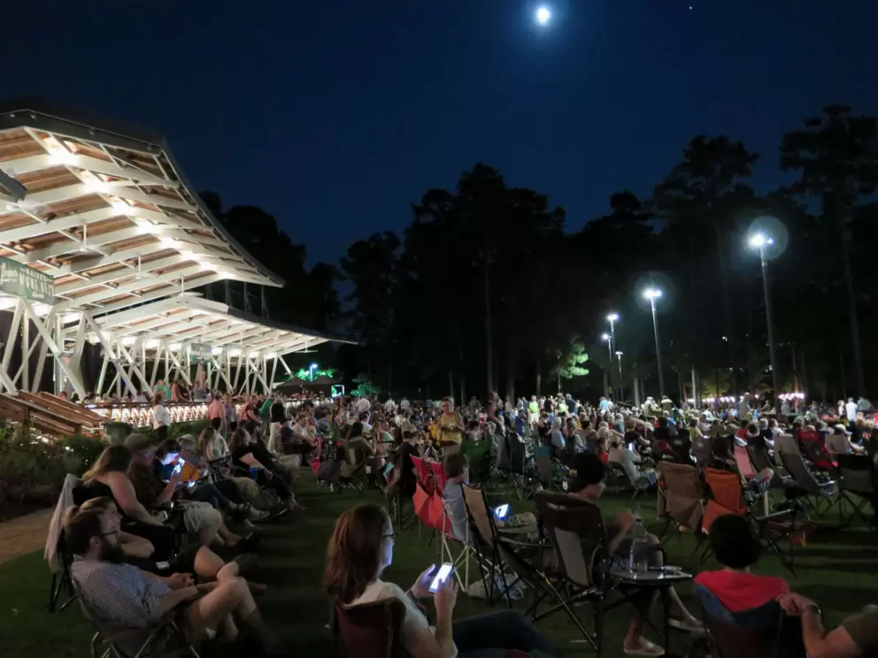 Moon, concessions, and dark pines in the distance.
