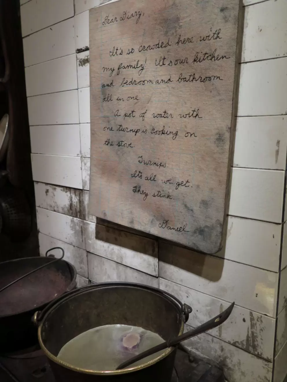 Dear Diary, It's so crowded in here with my family! It's our kitchen and bedroom and bathroom all in one. 