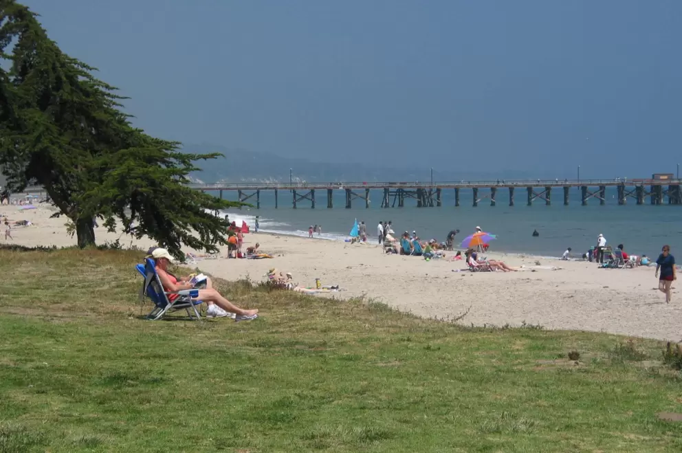 Reading a book in the sun at Goleta Beach.