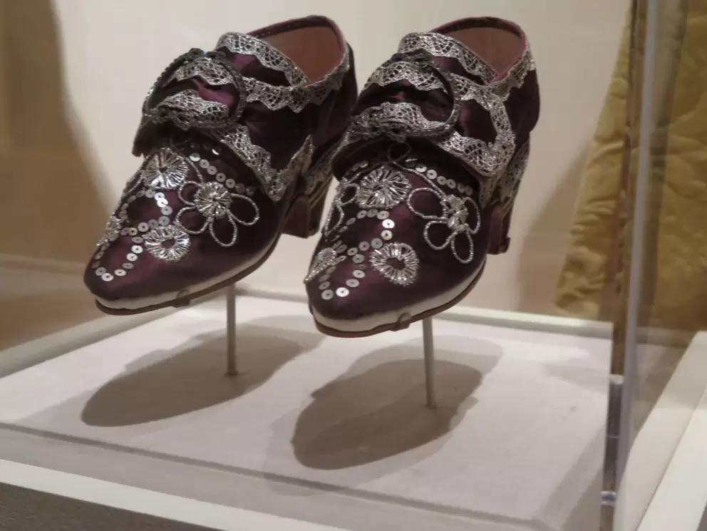 Reproduction of Martha Washington's wedding shoes worn in 1759. Silk with silver trim.