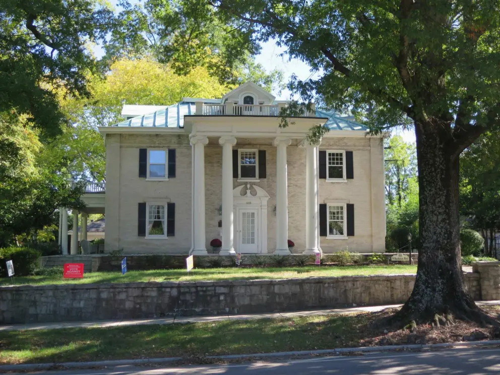 Grand historic home, as seen from the trail that runs along the perimeter of campus.