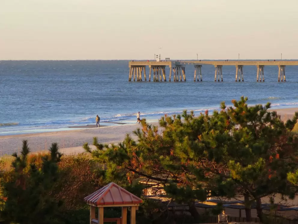 The pier and blue water.