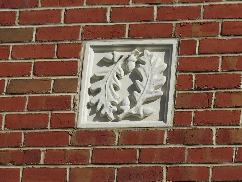 Decoration in the wall, near Oak Park Lane.