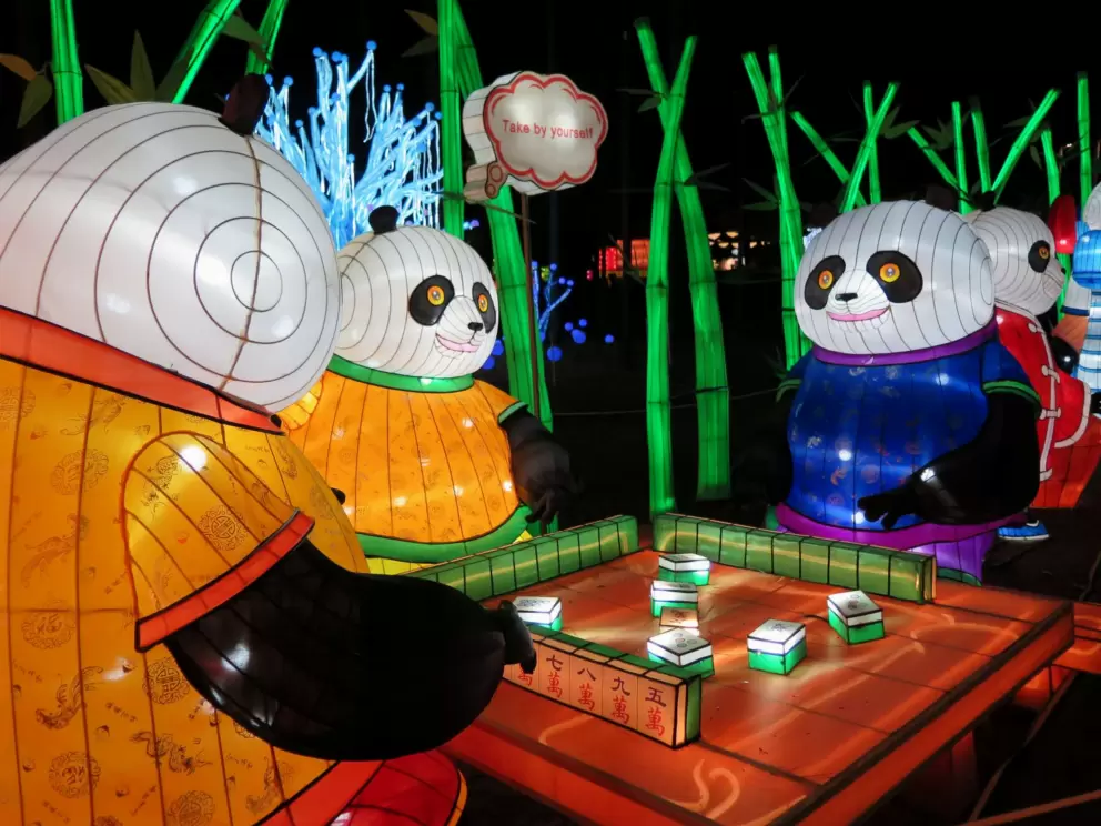 Pandas playing Mahjong!