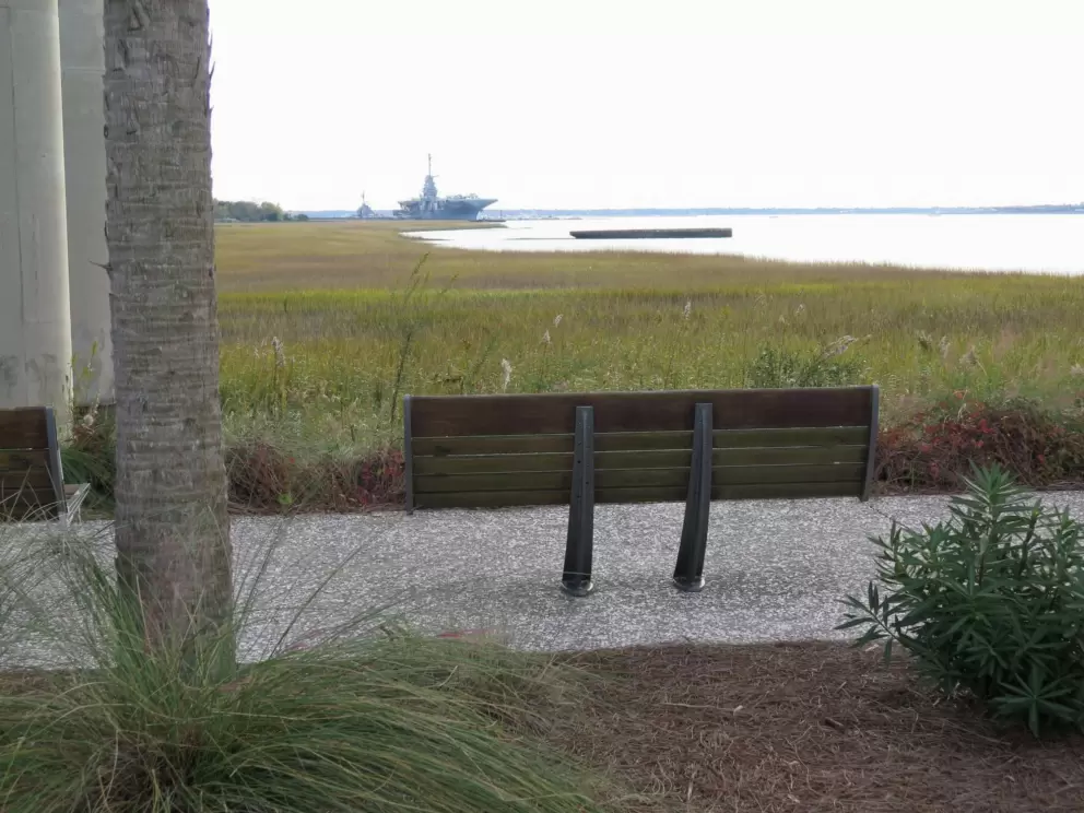 Bench looking past salt marshes to USS Yorktown.