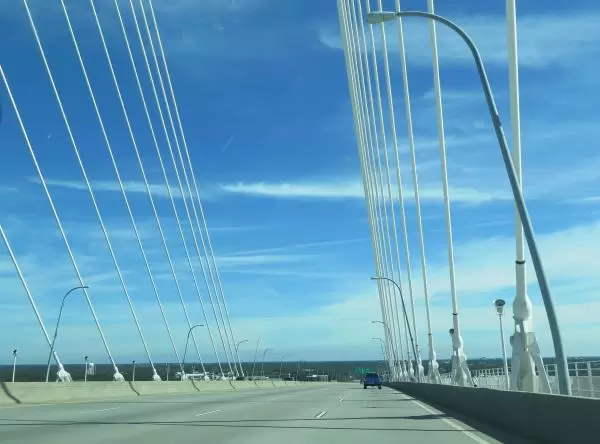 Driving over the bridge on a sunny day.