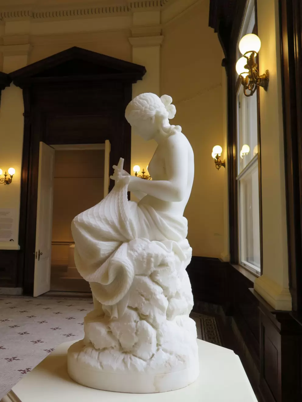 Sweet sculpture called Mending the Nets, by Chuancey Ives.